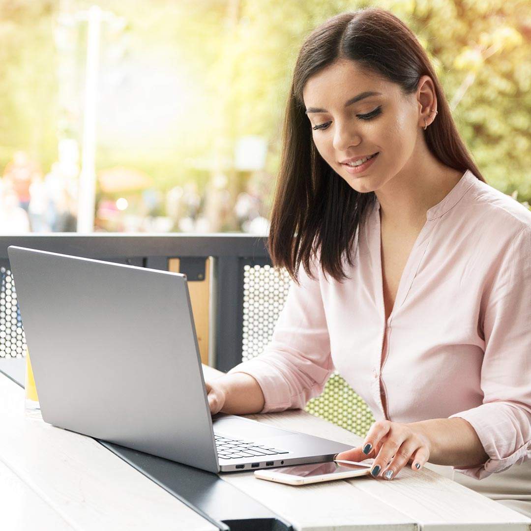 IT-Support-for-Schools-and-Education Woman using a computer to provide IT Support for Schools and Education