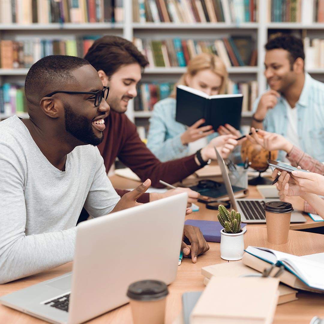 education-IT-services Students in a library making use of education IT services