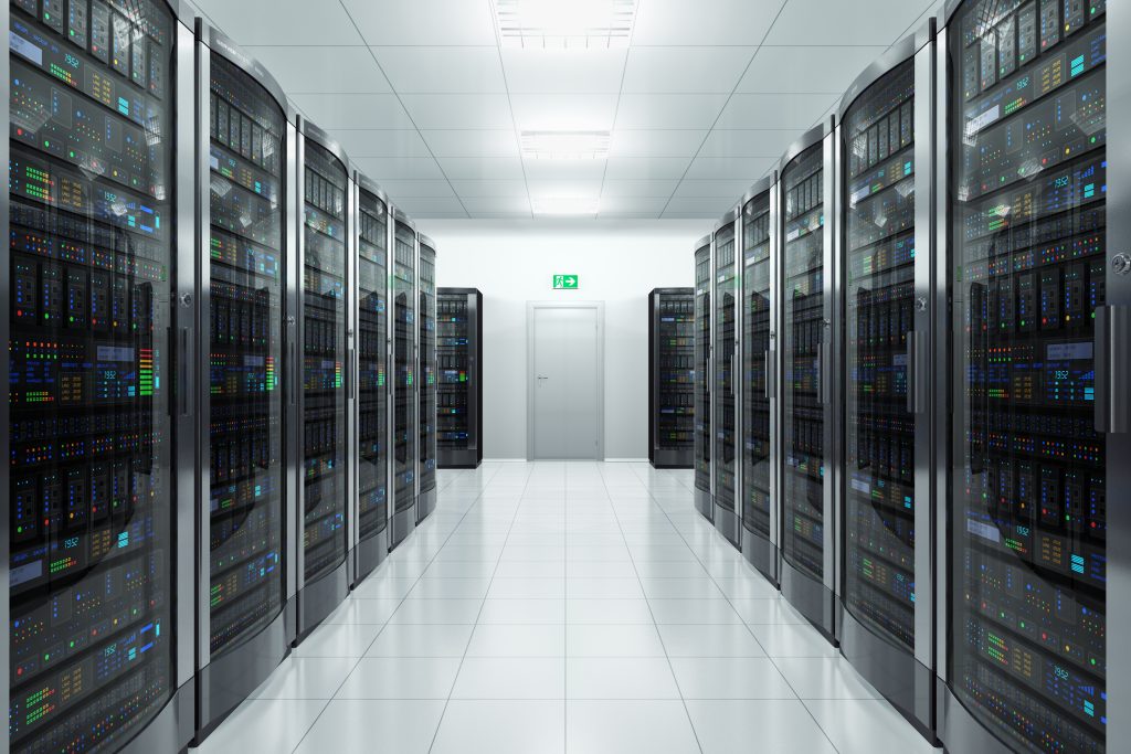 A corridor filled with server racks, representing the infrastructure of an outsourced IT help desk.